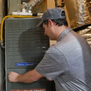Hvac technian working on furnace